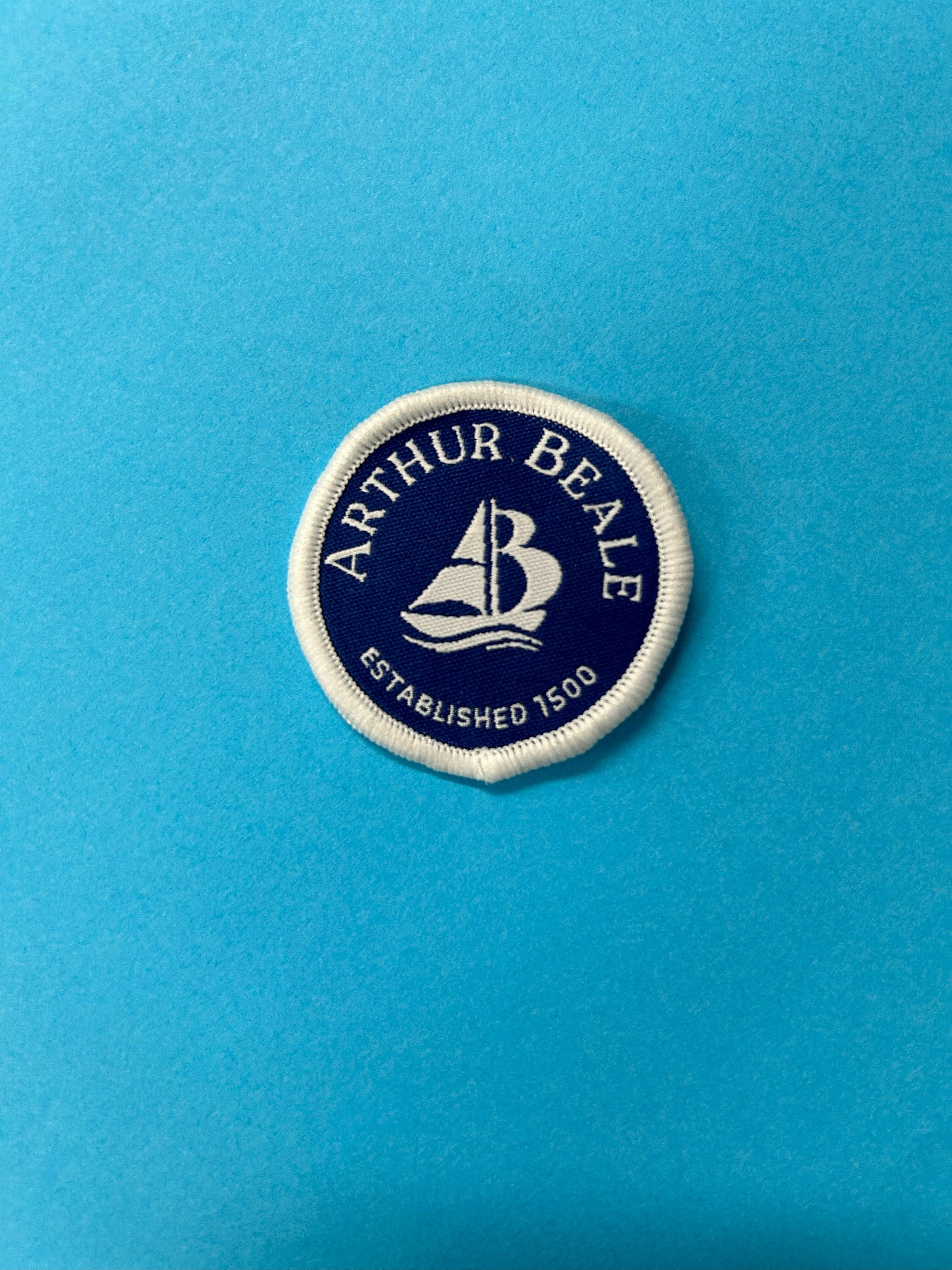 Arthur Beale current round Badge.